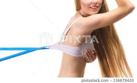 Woman wearing too big bra, loose band 136678420