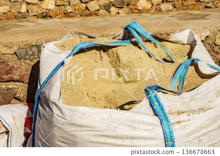 Construction area with big sand bag. Construction area with big sand bag. 136678663