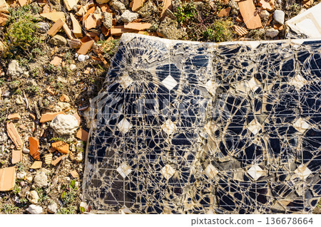 Damaged solar photovoltaic panel 136678664