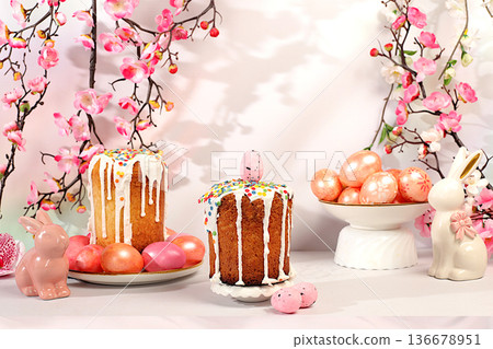 Happy Easter concept, abstract Easter composition featuring a traditional Russian meringue kulich and painted eggs on elegant kitchen table with spring cherry blossoms, banner for a greeting message Happy Easter concept, abstract Easter composition featuring a traditional Russian meringue kulich and painted eggs on elegant kitchen table with spring cherry blossoms, banner for a greeting message 136678951