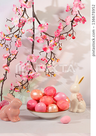 Abstract Easter composition with decorated eggs on an elegant kitchen table surrounded by spring cherry blossoms and bunnies. Happy Easter concept. Banner and beautiful greeting card Abstract Easter composition with decorated eggs on an elegant kitchen table surrounded by spring cherry blossoms and bunnies. Happy Easter concept. Banner and beautiful greeting card 136678952
