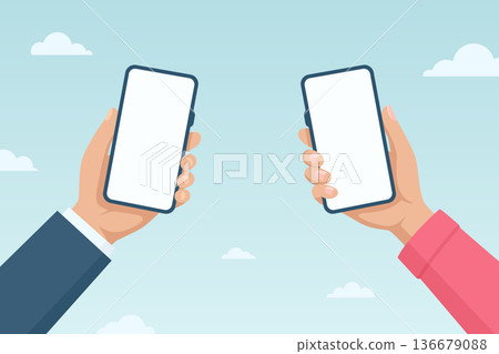 Flat Cartoon Vector Two Hands Holding Smartphones Facing Each Other on Sky Background. Mobile Phone Screen. Online Communication and Messaging Concept. Digital Sharing, Contactless Transfer 136679088