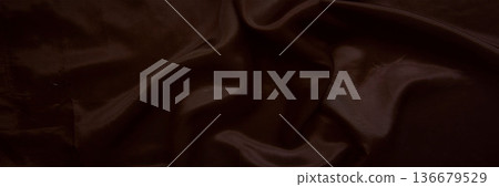Elegant dark chocolate brown silk fabric with smooth satin ripples 136679529