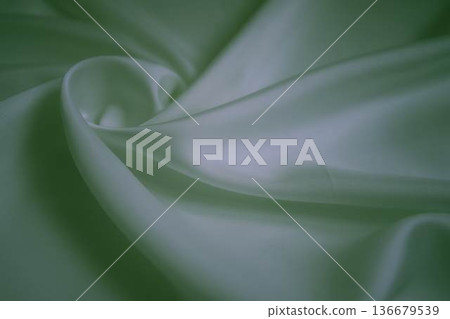 White silk fabric with neon green reflections and elegant swirls 136679539