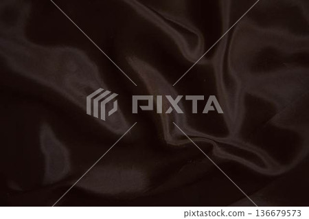 Elegant dark chocolate brown silk fabric with smooth satin ripples 136679573