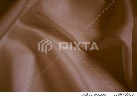 Elegant dusty rose silk fabric with soft flowing folds 136679590