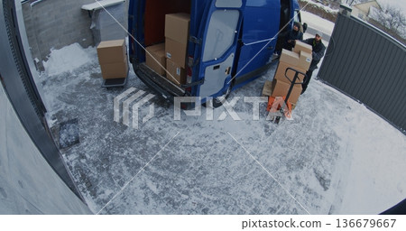 Team Unload Van Using Pallet Jack and Trolley Team Unload Van Using Pallet Jack and Trolley 136679667