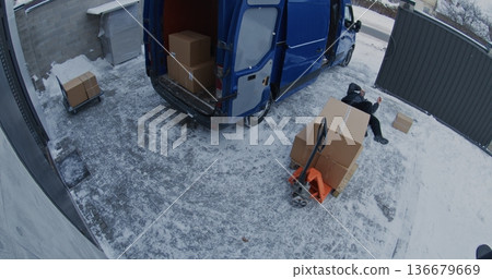 Adult Man Slips and Falls on Ice While Carrying Box From Van Adult Man Slips and Falls on Ice While Carrying Box From Van 136679669