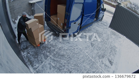Team Unload Van Using Pallet Jack and Trolley 136679672
