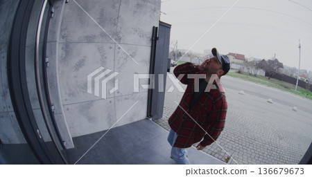 Intoxicated Adult Man Acting Erratically and Disoriented on Porch 136679673