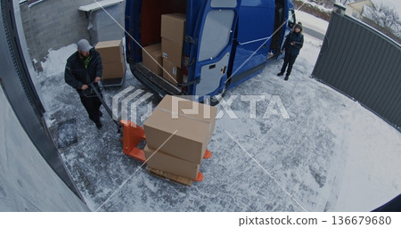 Team Unload Van Using Pallet Jack and Trolley Team Unload Van Using Pallet Jack and Trolley 136679680
