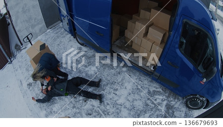 Bearded Courier Slips on Ice While Unloading Van and Suffers Serious Injury 136679693