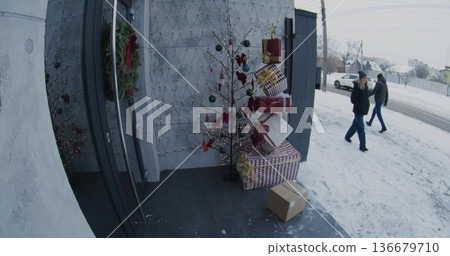 Woman Walks Past Christmas Decorated Porch, Suddenly Grabs Delivery Package From Doorstep Woman Walks Past Christmas Decorated Porch, Suddenly Grabs Delivery Package From Doorstep 136679710