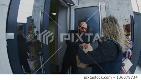Courier With Large Delivery Backpack Arrives at House and Rings Doorbell Courier With Large Delivery Backpack Arrives at House and Rings Doorbell 136679734