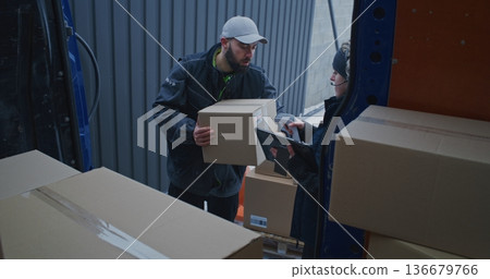 Man Waits by Blue Van Until Woman Joins Start Work Man Waits by Blue Van Until Woman Joins Start Work 136679766