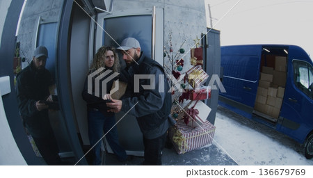 Bearded Courier Hands Over Parcel and Manages Electronic Signature Process Bearded Courier Hands Over Parcel and Manages Electronic Signature Process 136679769