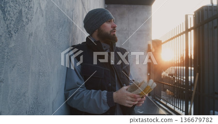 Man Leaning Against Wall Catch Breath After Intense Work 136679782