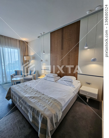 Medium View of Room Interior with Bed, Chairs, Floor Lamp, and Coffee Table Medium View of Room Interior with Bed, Chairs, Floor Lamp, and Coffee Table 136680324