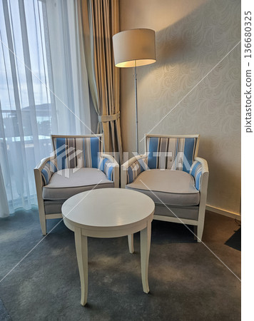 Blue and White Armchairs with Floor Lamp and Coffee Table Interior 136680325
