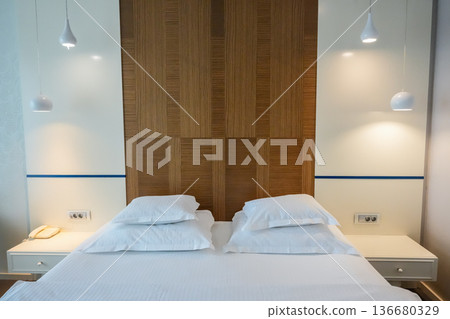 Front View of Bed with White Pillows and Duvet Front View of Bed with White Pillows and Duvet 136680329