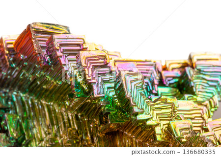 Macro of the mineral bismuth stone on a white background Macro of the mineral bismuth stone on a white background 136680335