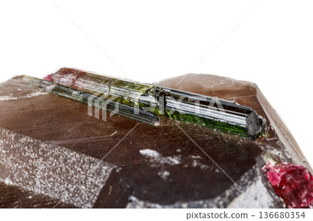 Macro mineral tourmaline stone in quartz on a white background Macro mineral tourmaline stone in quartz on a white background 136680354