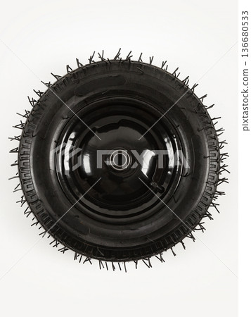 Wheel is pneumatic on a white background. Black rubber and disc. Wheel is pneumatic on a white background. Black rubber and disc. 136680533