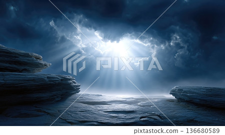 Dark Rocky Desert Ravine Under Turbulent Sky With Light Breaking Through Clouds at Dusk 136680589