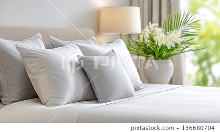 Relaxing Space With Soft Pillows and Elegant Decor in a Cozy Bedroom Setting During Daylight 136680704