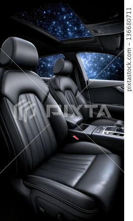 Interior View of a Modern Car With Leather Seats and a Starry Sky in the Background at Night 136680711