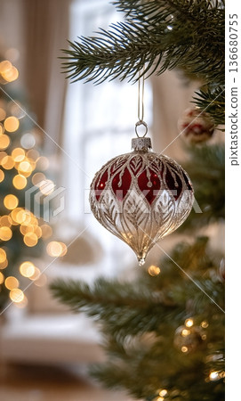 Festive Decoration Hanging on a Christmas Tree in a Cozy Room With Warm Lights 136680755