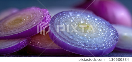 Closeup View of Sliced Onions With Water Droplets on a Clean Surface in a Kitchen Setting Closeup View of Sliced Onions With Water Droplets on a Clean Surface in a Kitchen Setting 136680884