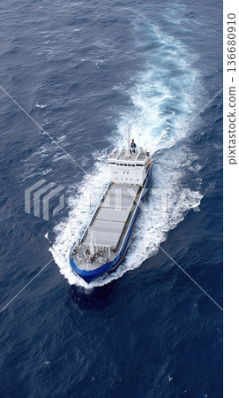 Container Ship Navigates Ocean Waters While Transporting Goods Across the Sea to Distant Ports Container Ship Navigates Ocean Waters While Transporting Goods Across the Sea to Distant Ports 136680910