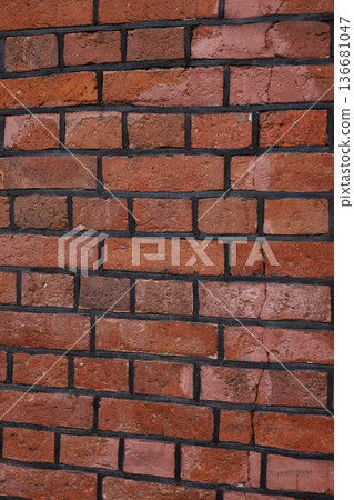 Red brick wall with uniform rectangular bricks and white mortar lines Red brick wall with uniform rectangular bricks and white mortar lines 136681047