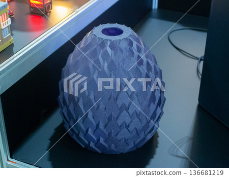 Art form printed on 3D printer from plastic. Art shape made using 3D printing from filament. Additive manufacturing. Layer-by-layer application of material. 3D printing technologies. FDM technology Art form printed on 3D printer from plastic. Art shape made using 3D printing from filament. Additive manufacturing. Layer-by-layer application of material. 3D printing technologies. FDM technology 136681219