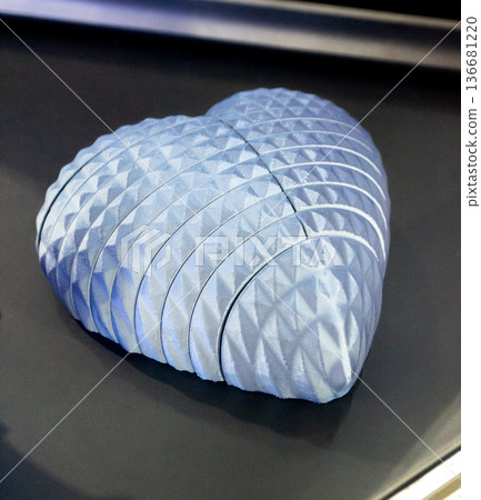 Art form printed on 3D printer from plastic. Art shape made using 3D printing from filament. Additive manufacturing. Layer-by-layer application of material. 3D printing technologies. FDM technology Art form printed on 3D printer from plastic. Art shape made using 3D printing from filament. Additive manufacturing. Layer-by-layer application of material. 3D printing technologies. FDM technology 136681220