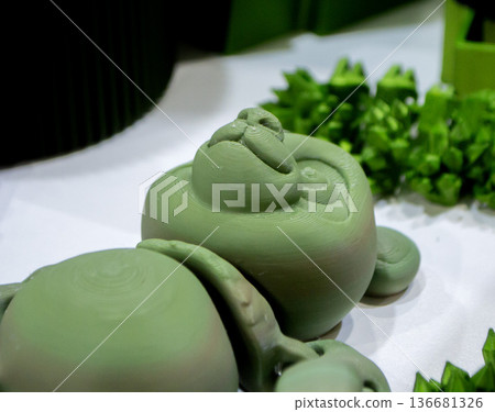 Art form printed on 3D printer from plastic. Art shape made using 3D printing from filament. Additive manufacturing. Layer-by-layer application of material. 3D printing technologies. FDM technology Art form printed on 3D printer from plastic. Art shape made using 3D printing from filament. Additive manufacturing. Layer-by-layer application of material. 3D printing technologies. FDM technology 136681326