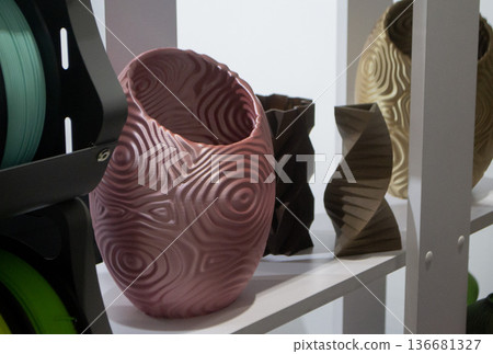 Art form printed on 3D printer from plastic. Art shape made using 3D printing from filament. Additive manufacturing. Layer-by-layer application of material. 3D printing technologies. FDM technology Art form printed on 3D printer from plastic. Art shape made using 3D printing from filament. Additive manufacturing. Layer-by-layer application of material. 3D printing technologies. FDM technology 136681327