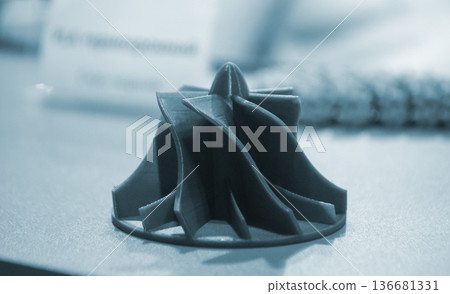 Art form printed on 3D printer from plastic. Art shape made using 3D printing from filament. Additive manufacturing. Layer-by-layer application of material. 3D printing technologies. FDM technology Art form printed on 3D printer from plastic. Art shape made using 3D printing from filament. Additive manufacturing. Layer-by-layer application of material. 3D printing technologies. FDM technology 136681331