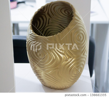 Art form printed on 3D printer from plastic. Art shape made using 3D printing from filament. Additive manufacturing. Layer-by-layer application of material. 3D printing technologies. FDM technology Art form printed on 3D printer from plastic. Art shape made using 3D printing from filament. Additive manufacturing. Layer-by-layer application of material. 3D printing technologies. FDM technology 136681335