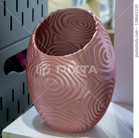 Art form printed on 3D printer from plastic. Art shape made using 3D printing from filament. Additive manufacturing. Layer-by-layer application of material. 3D printing technologies. FDM technology Art form printed on 3D printer from plastic. Art shape made using 3D printing from filament. Additive manufacturing. Layer-by-layer application of material. 3D printing technologies. FDM technology 136681338