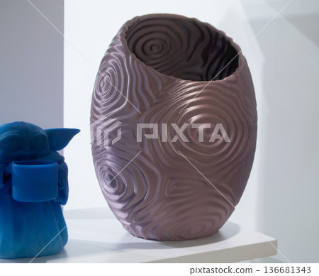 Art form printed on 3D printer from plastic. Art shape made using 3D printing from filament. Additive manufacturing. Layer-by-layer application of material. 3D printing technologies. FDM technology Art form printed on 3D printer from plastic. Art shape made using 3D printing from filament. Additive manufacturing. Layer-by-layer application of material. 3D printing technologies. FDM technology 136681343