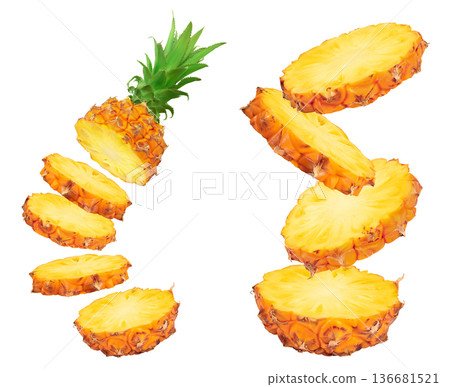 falling pineapple slices isolated on white background with full depth of field 136681521