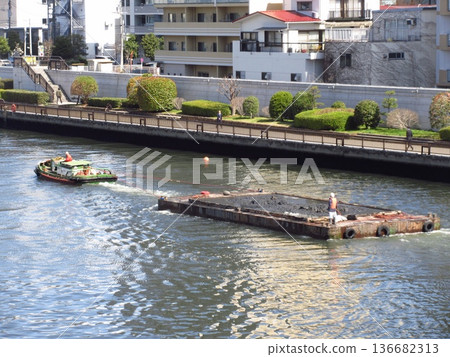 Scene of sediment transport work on an urban river (Sumida River) 136682313