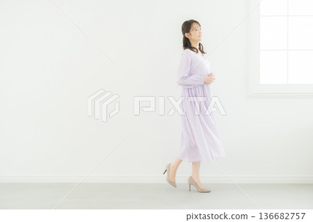 A woman in a lavender dress A woman in a lavender dress 136682757