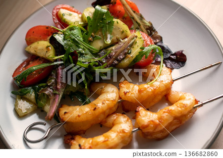 Grilled Shrimp Skewers with Fresh Garden Salad 136682860