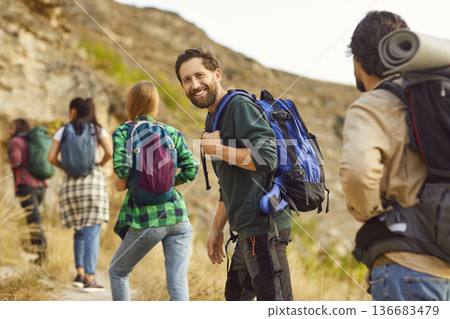 Happy Man Hiking With Friends On Vacation 136683479