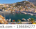 Sunny Harbor With Boats And Colorful Houses on Symi Island Greece 136684277