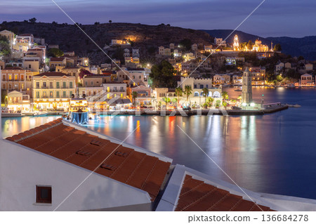 Evening Harbor View With Colorful Houses in Symi Island Greece Evening Harbor View With Colorful Houses in Symi Island Greece 136684278