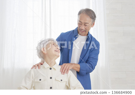 Married couple in the living room 136684900